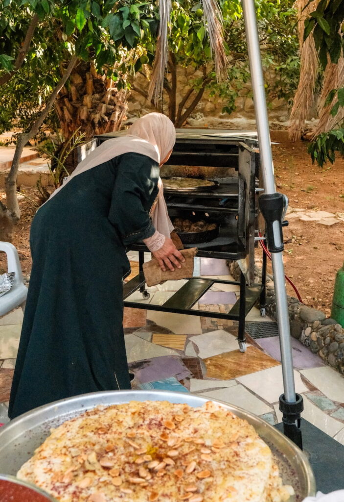 best restaurants in amman - woman making bread and lunch