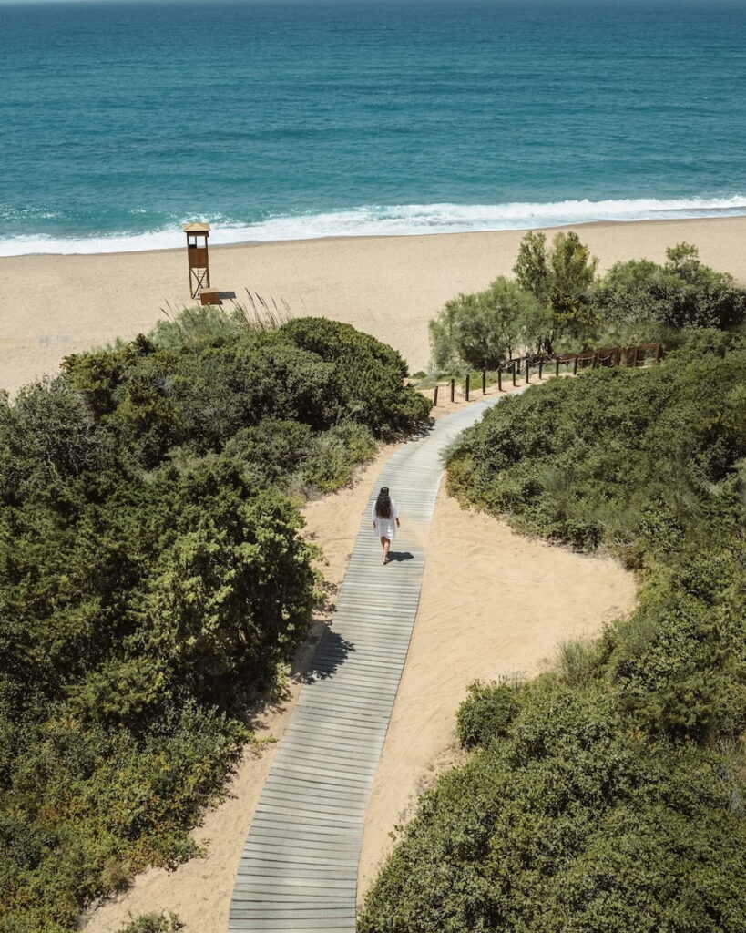 white sandy beach at Romanos, a Luxury Collection Resort 