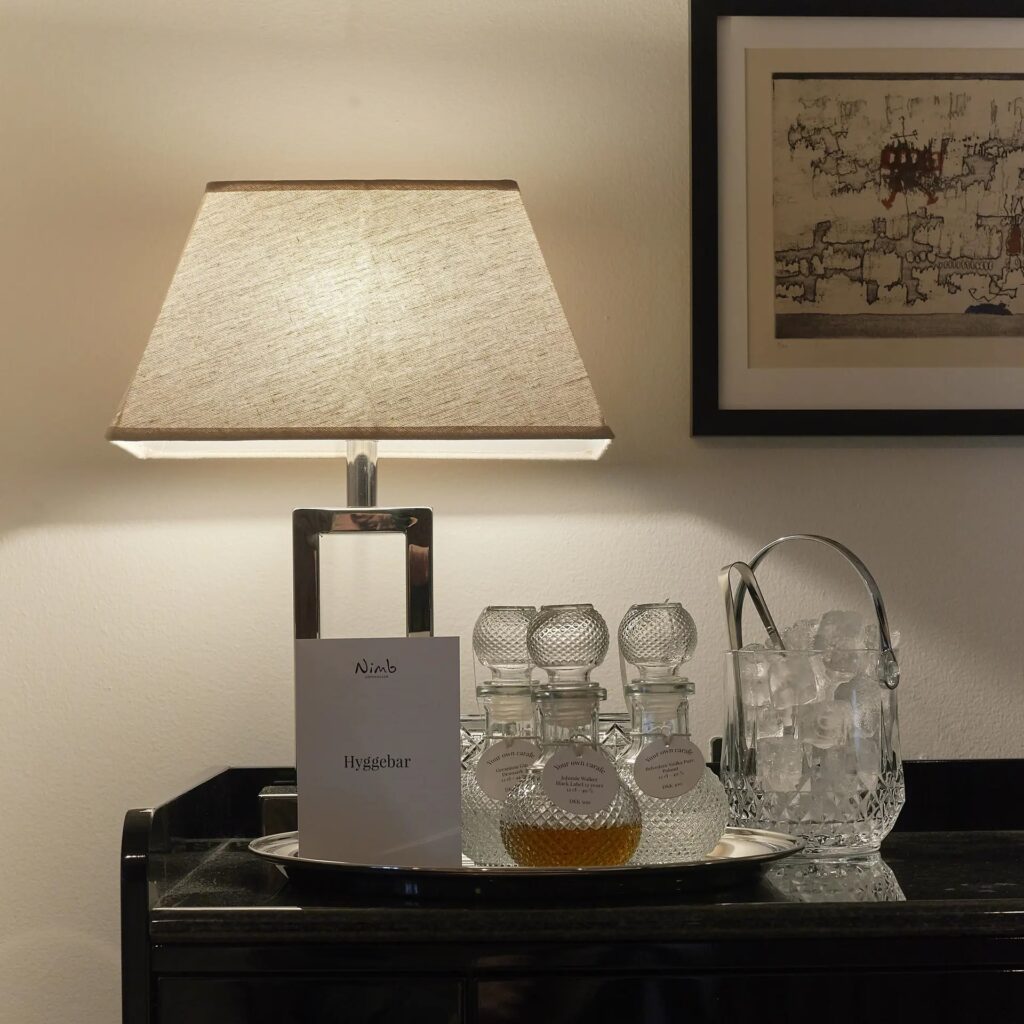 The charming in-room mini bar offers complimentary soft drinks and local snacks